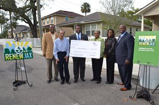 LISC presented a check at the RenewJax announcement on Nov. 24, 2014