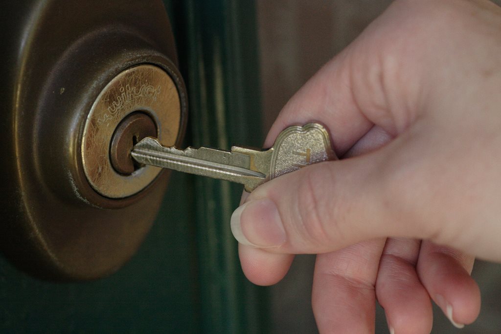 Inserting a key into a door lock