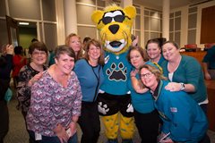City employees with the Jaguars' mascot at the Sack the Steelers Send-off on Jan. 12, 2018.