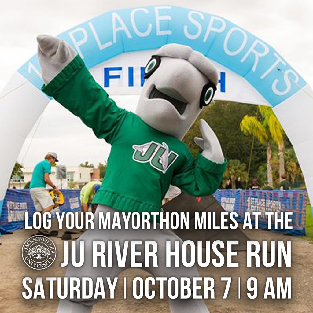 JU Dolphin Mascot Posing in Front of 5k Finish Line