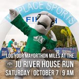 JU Dolphin Mascot Posing in Front of 5k Finish Line