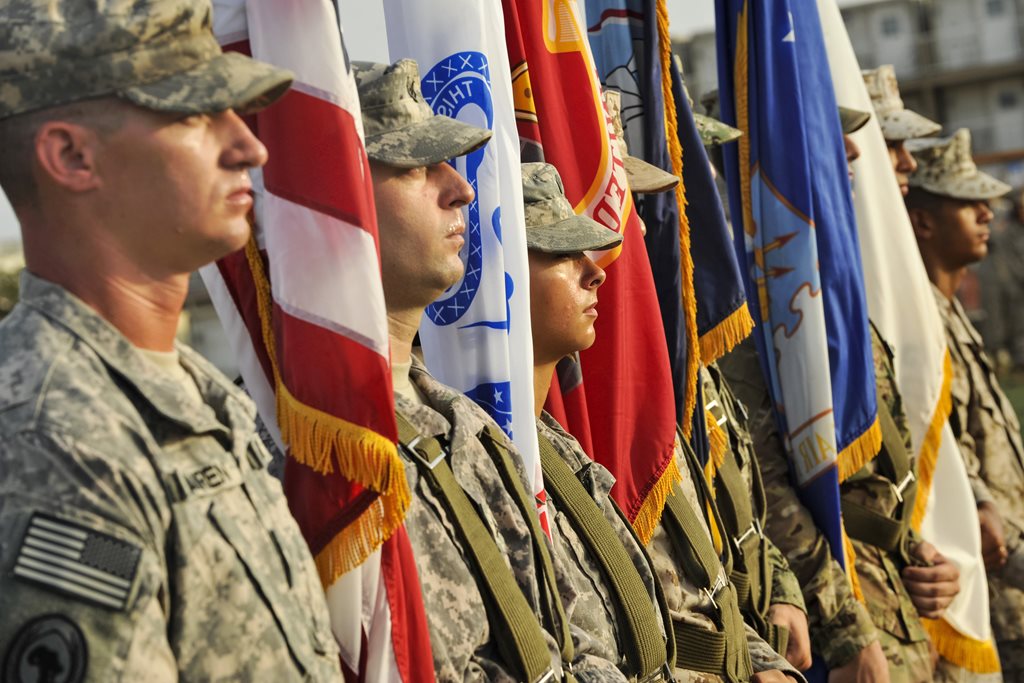 A color guard stands in formation during a Memorial Day ceremony at Camp Lemonnier