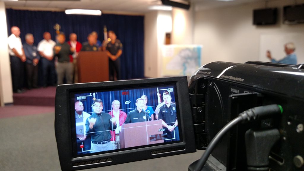 Filming a news conference in the Emergency Operations Center
