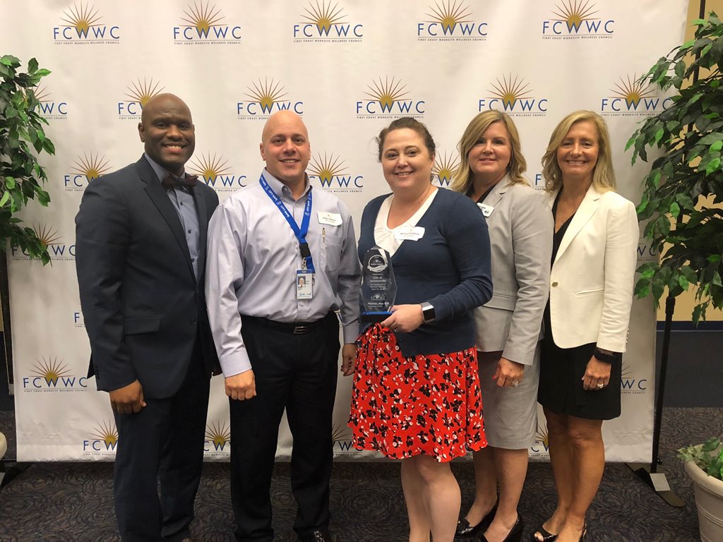 Group of Jacksonville employees accepting FCWWC wellness award