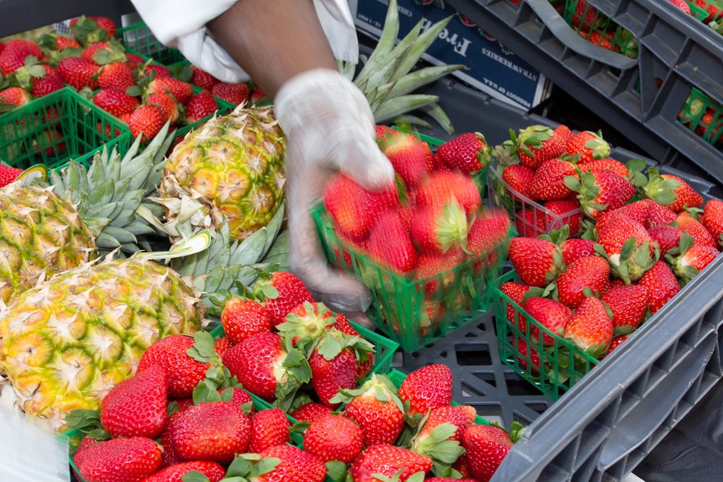 Fresh pineapples and strawberries