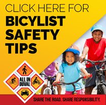BYCYCLIST SAFETY BUTTON: photo young children riding bikes