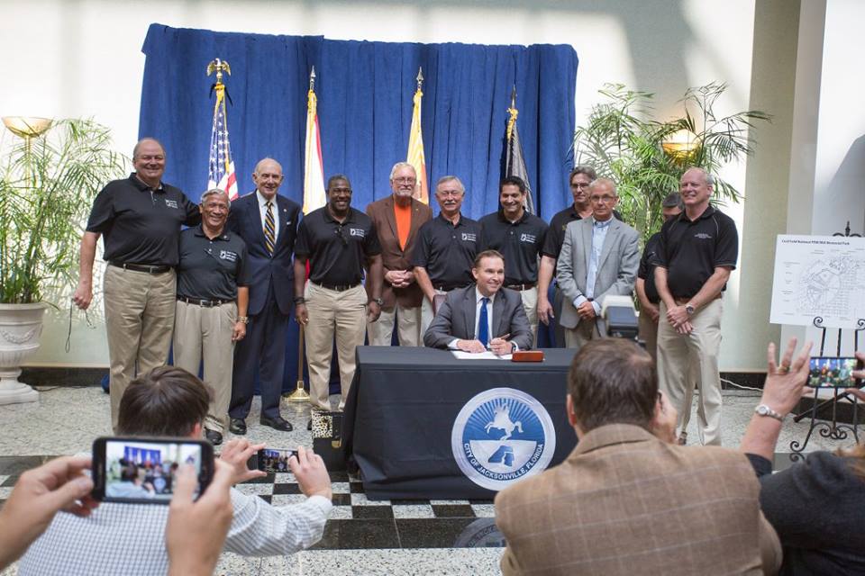 This is a picture of Mayor Curry and representatives of the POW/MIA Memorial Inc. signing the bill.