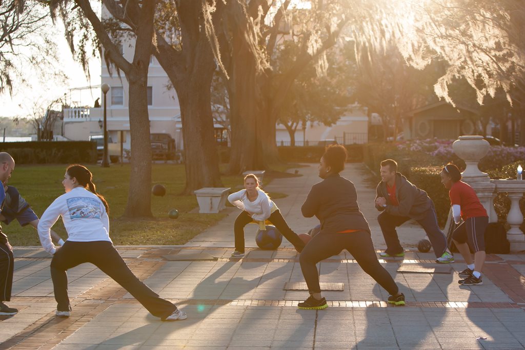 A group of residents stretching in Riverside's historic Memorial Park.