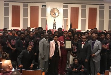 April 10, 2018 photo of City Council presenting a resolution to the students athletes on the William Raines High School Vikings Football Team.