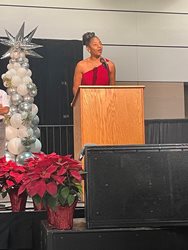 Photo of City Council Member Clark-Murray speaking to the participants at the Holiday Festival