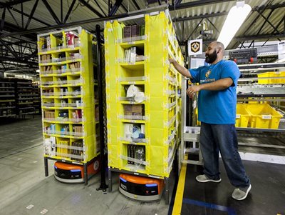 An employee working at one of Amazon's existing fulfillment centers (image courtesy of Amazon)