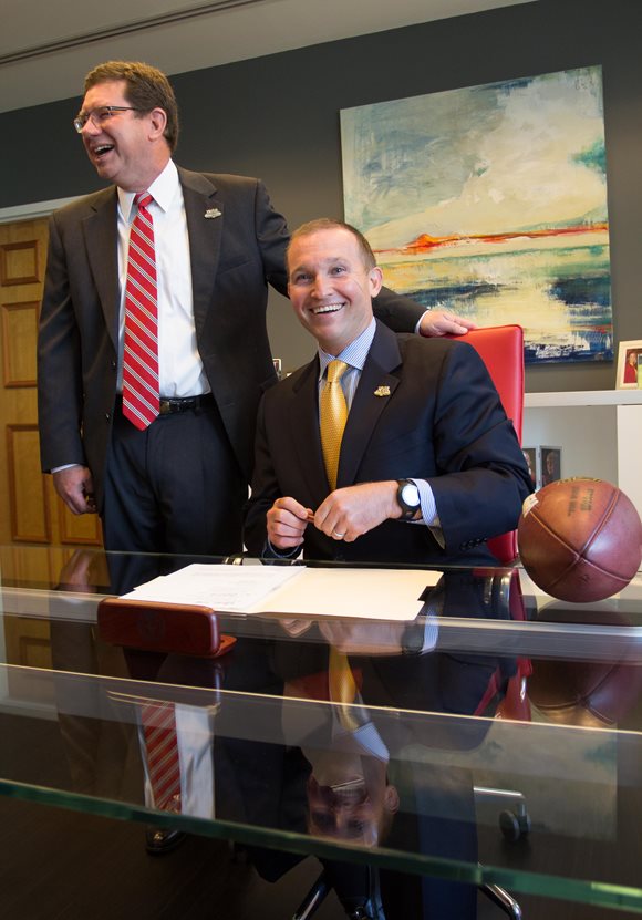 Mayor Lenny Curry signs the term sheet extending the Georgia-Florida contact with City Council President Greg Anderson