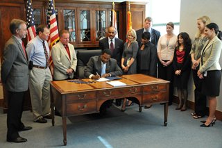 Mayor Alvin Brown signing the Reform legislation