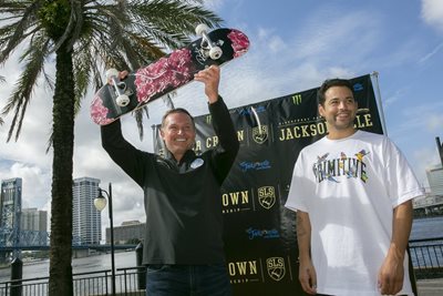 Mayor Lenny Curry holding skateboard