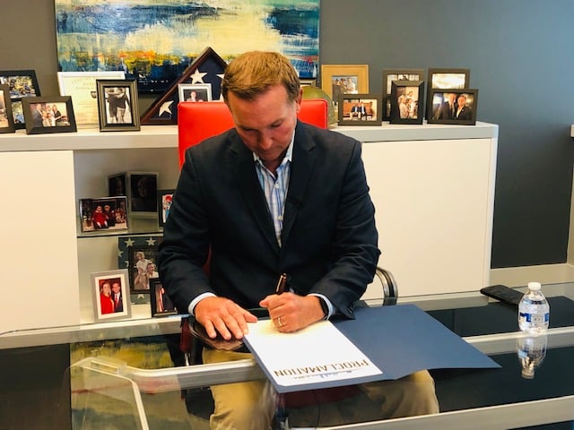 Mayor Lenny Curry signing ADA Awareness Day proclamaton in his office