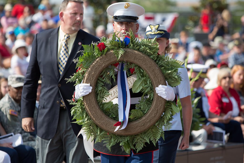 A marine holding a wreath at one of Jacksonville's Memorial Day Observance ceremonies. 