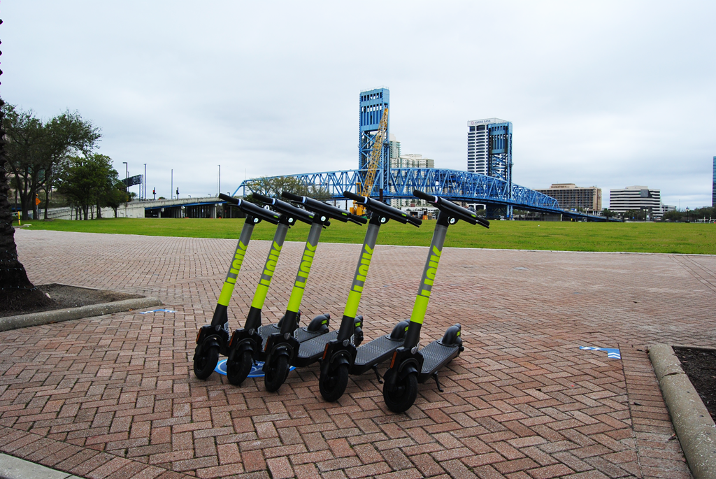 LINK Electric Scooters Parked in Designated, Geofenced Corral adjacent to Riverfront Plaza