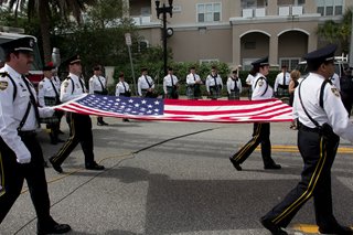 The Jacksonville Sheriff's Office Honor Guard carrying the American Flag during the Police Memorial Day ceremonies on May 1, 2014