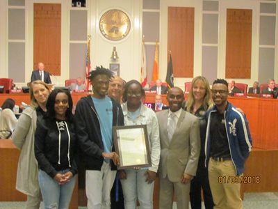 January 9, 2018 photo of Council Member Garrett Dennis presenting a resolution honoring and commending the Jax Zoo W.I.L.D. Ambassadors.