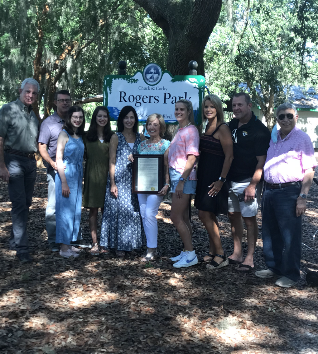 Photo of Council Member Boylan (Far Left), Council Member Hazouri (Far right) with Corky's wife Linda and the Rogers family.