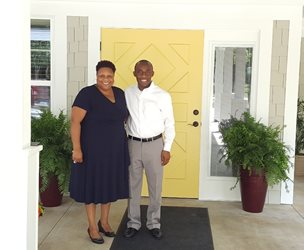 August 9, 2017 photo of Councilman Garrett Dennis with Dayatra Coles, Affordable Housing Administrator, at a tour of Kayden Place.