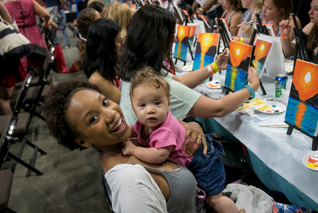 smiling mother and child at military spouse night out event