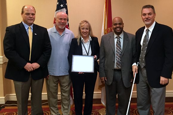 From left – Florida Division of Blind Services District 3 Administrator Robert Lewis, Chair of the Rehabilitation Council for the Blind Robert Kelly, Chief of City’s Disabled Services Division Beth Meyer, Director of Division of Blind Services Robert Doyle