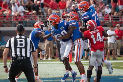 Florida Georgia Football Players and Referee on the Field