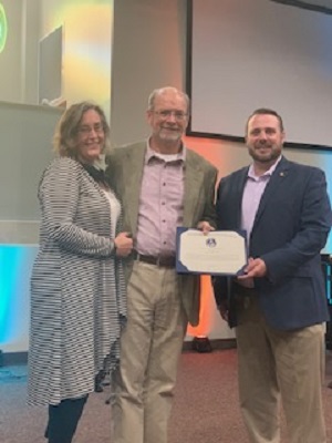 Photo of Council Member Carrico presenting the District 4 Hometown Hero Certificate to Pastor Albert Byrd and wife Amy.