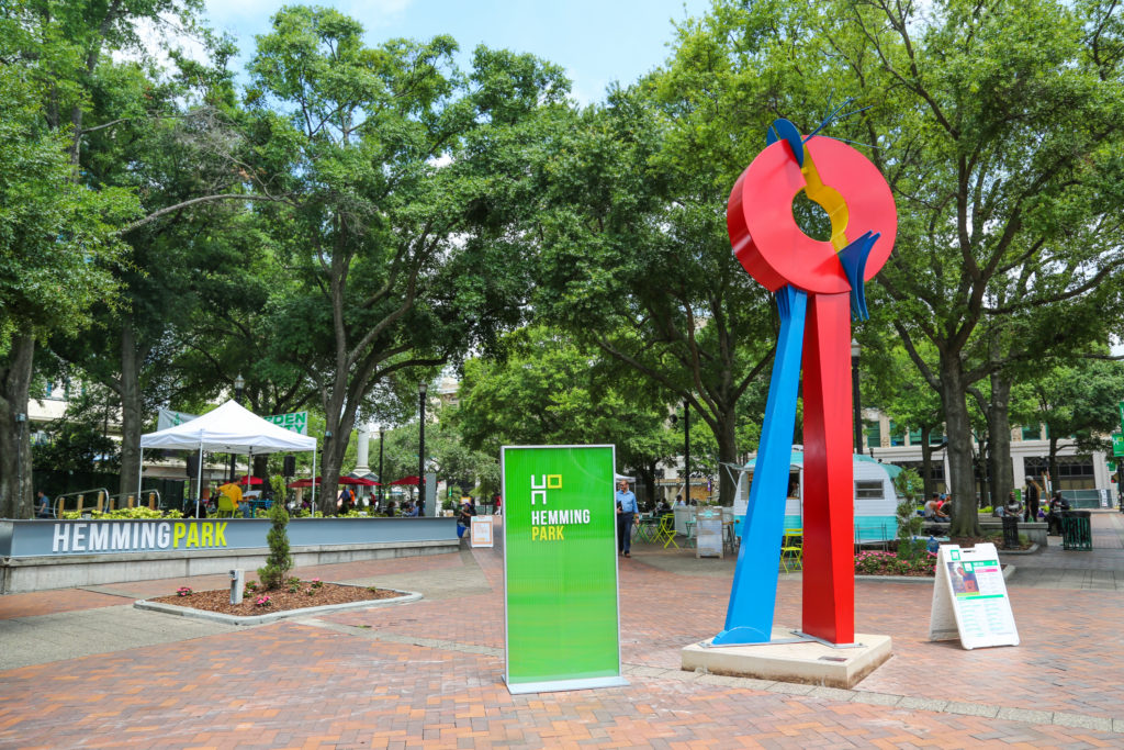 entrance to hemming park with opposing forces sculpture
