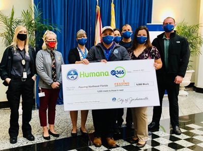 City employees with oversized charity check