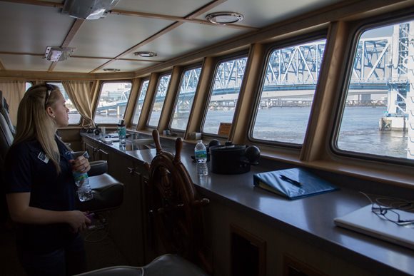An OCEARCH crew member enjoys a view of downtown Jacksonville's Main Street Bridge from the bridge of the M/V OCEARCH.