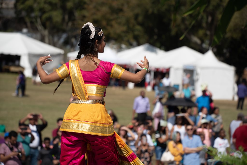 woman performing dance in front of crowd