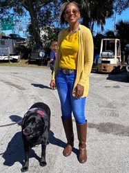 Photo of Council Member Tyrona Clark-Murray with Fire Dog Gunner