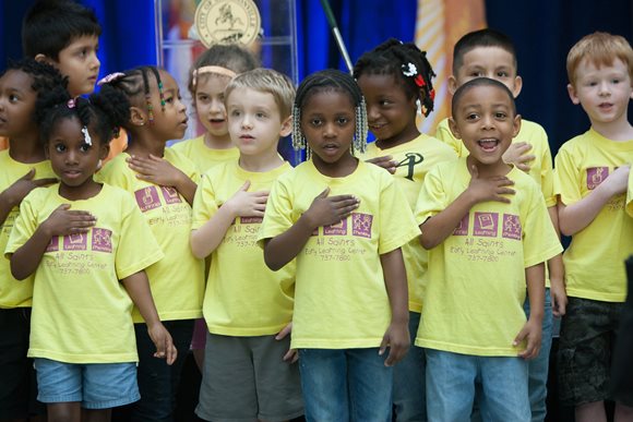 Kids leading the pledge of allegiance at the Jacksonville Children's Commission's 21st birthday celebration at City Hall on April 26, 2016