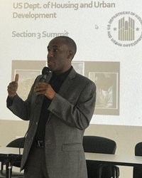 July 26, 2018 photo of Council Member Garrett Dennis speaking at the United States Department of Housing and Urban Development Section 3 Summit.