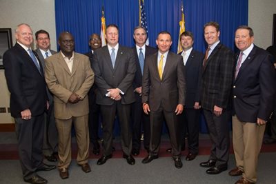City leaders join Ernst & Young company representative for the announcement at City Hall on March 3, 2016