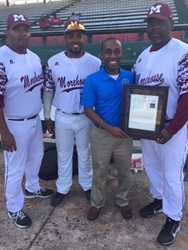 February 21, 2018 photo of Council Member Garrett Dennis with members of the Morehouse Maroon Tigers at Edward Waters College.