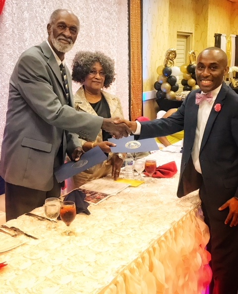 September 1, 2018 photo of Council Member Garrett Dennis with Mister and Misses Harold Pierce at their eightieth birthday celebration. 