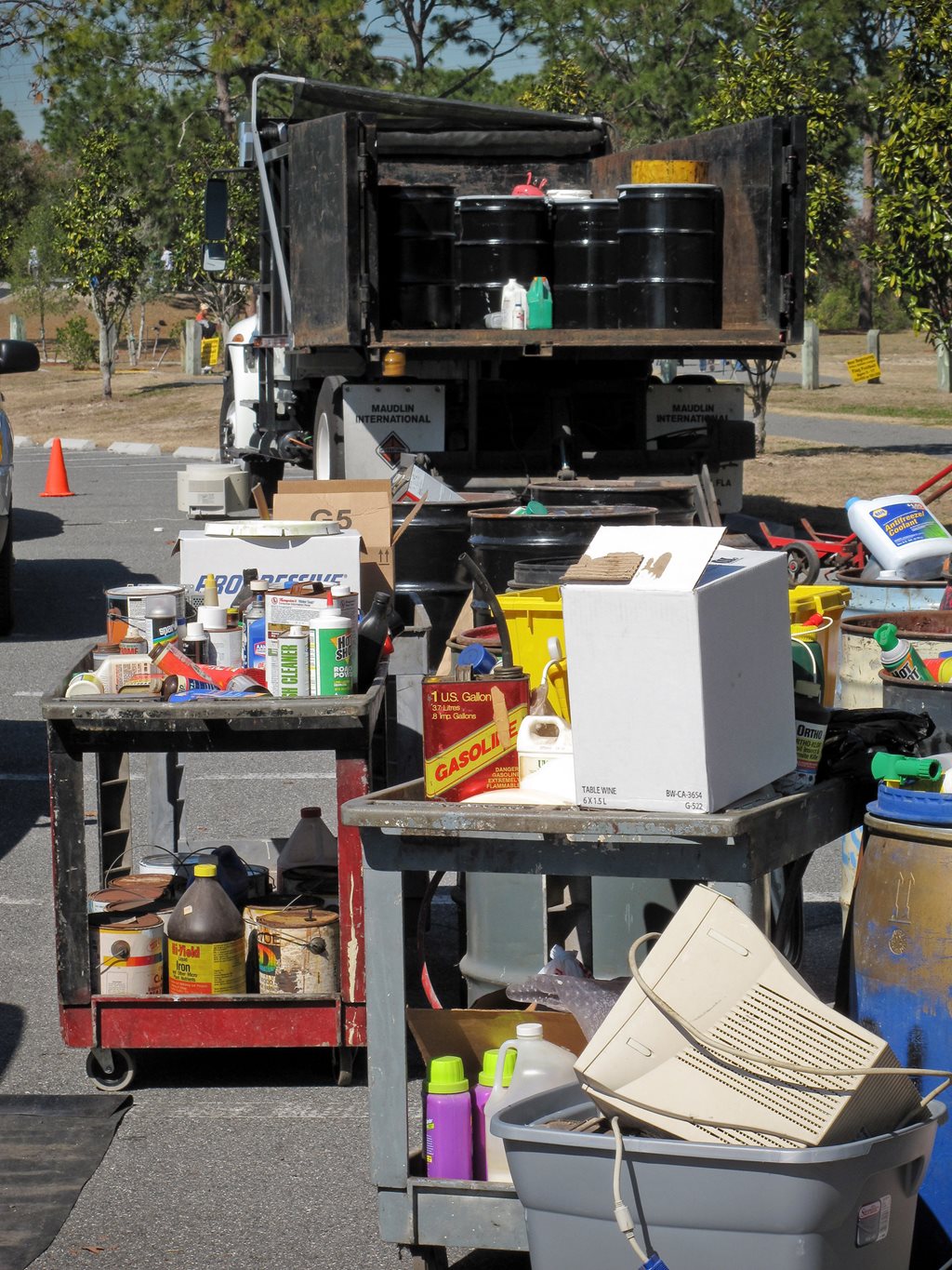 Paint cans and e-waste at a household waste collection event