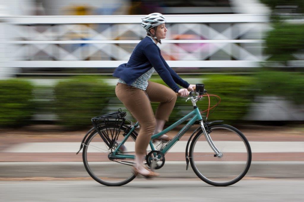 A cyclist commuting on a Jacksonville roadway.