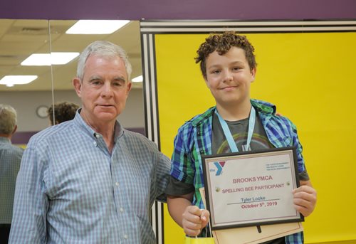 Pctober 5, 2019 photo of Council Member Boylan with Tyler Locke who participated in the Brooks YMCA spelling bee.