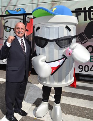 Photo of Jacksonville Children's Commission Executive Director Jon Heymann with the Fight the Blight Mascot.