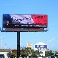 A billboard promoting the 450th anniversary of Jean Ribault's arrival