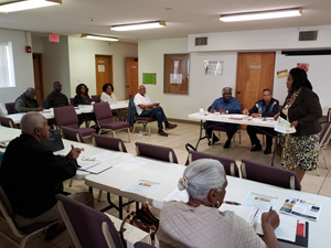 Photo of Council Member Ju'Coby Pittman speaking at the Northside Ministerial Alliance Monthly Meeting