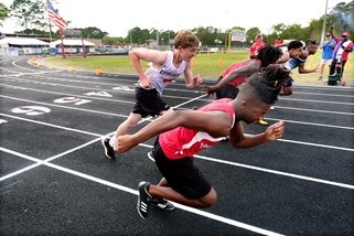 Athletes running on outdoor track