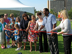 Picture of Council Member Dr. Johnny Gaffney (second from the right) and others cutting the ribbon at the opening of the Confederate Park dog park.