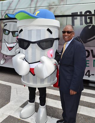 Photo of Council Member Warren Jones with the Fight the Blight Mascot.