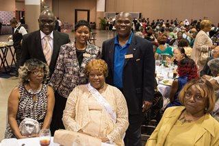 Photo of Council Members Sam Newby, Katrina Brown, and Reggie Gaffney with attendees at the Senior Prom.
