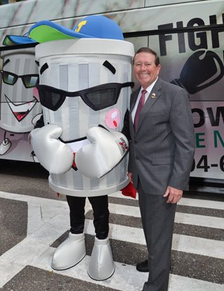 Photo of Council Member Jim Love with the Fight the Blight Mascot.
